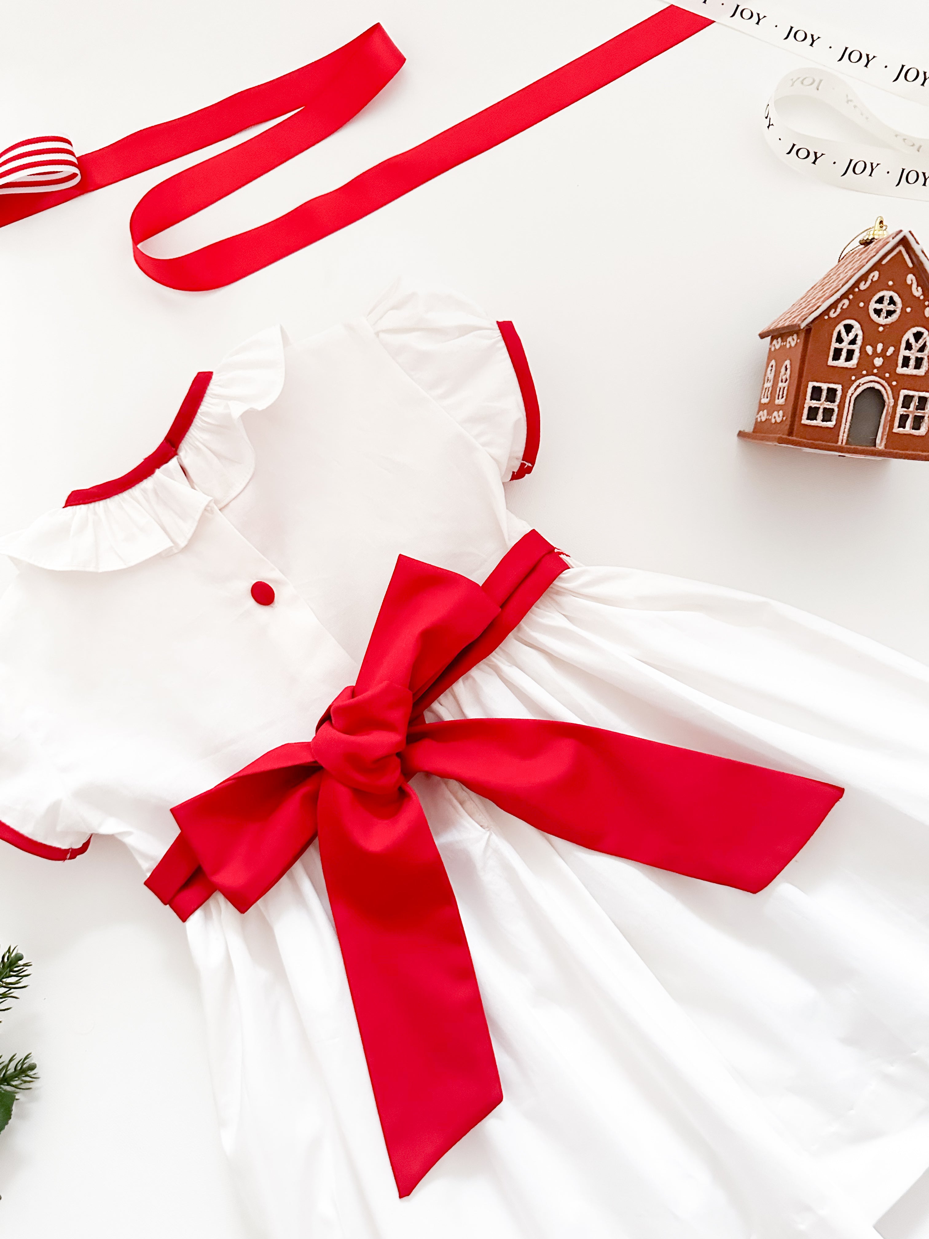 The hand smocked BENEDICTE dress - in white and red