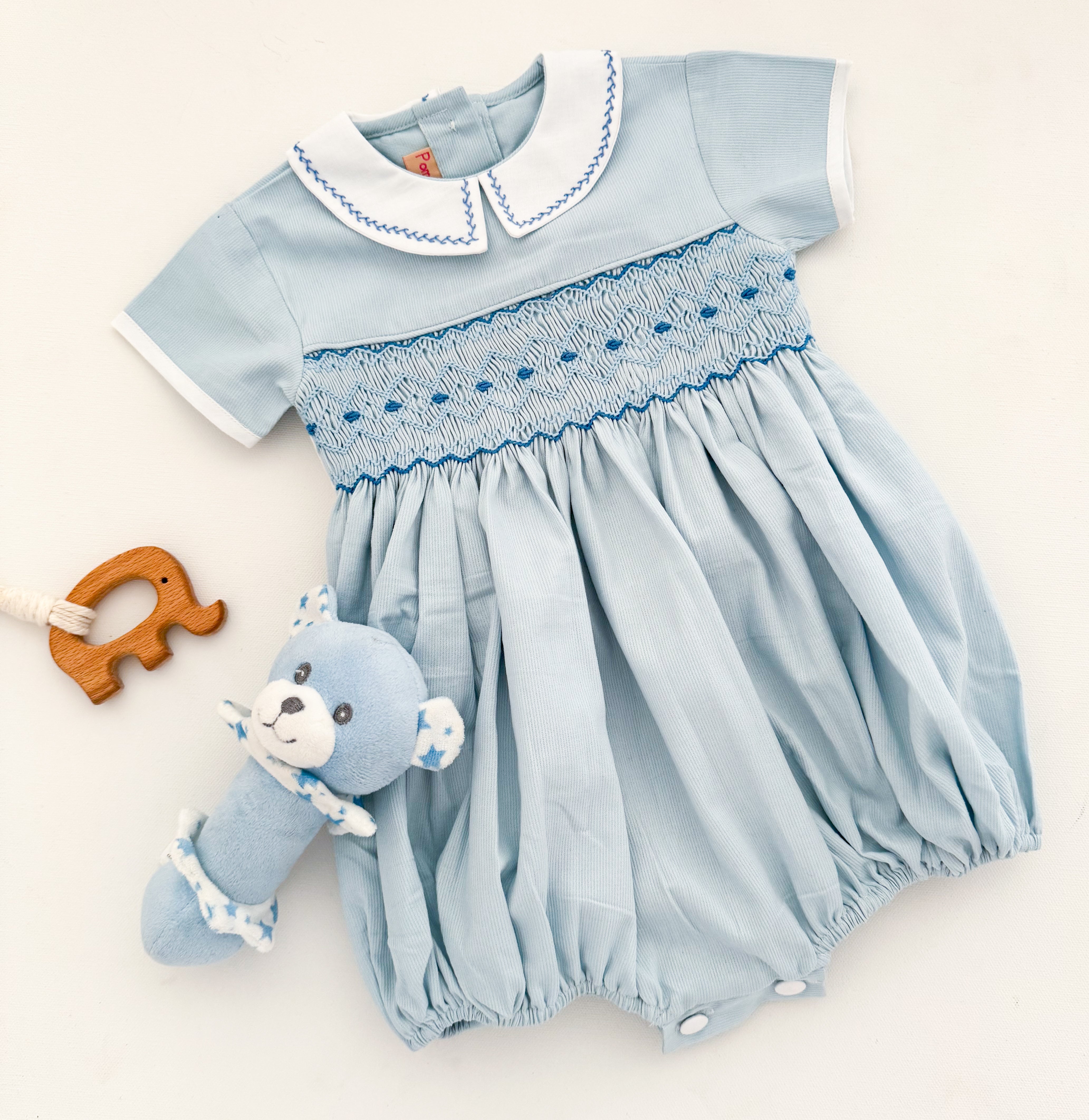 The hand smocked ANDRÉA romper - Blue