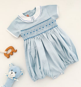 The hand smocked ANDRÉA romper - Blue