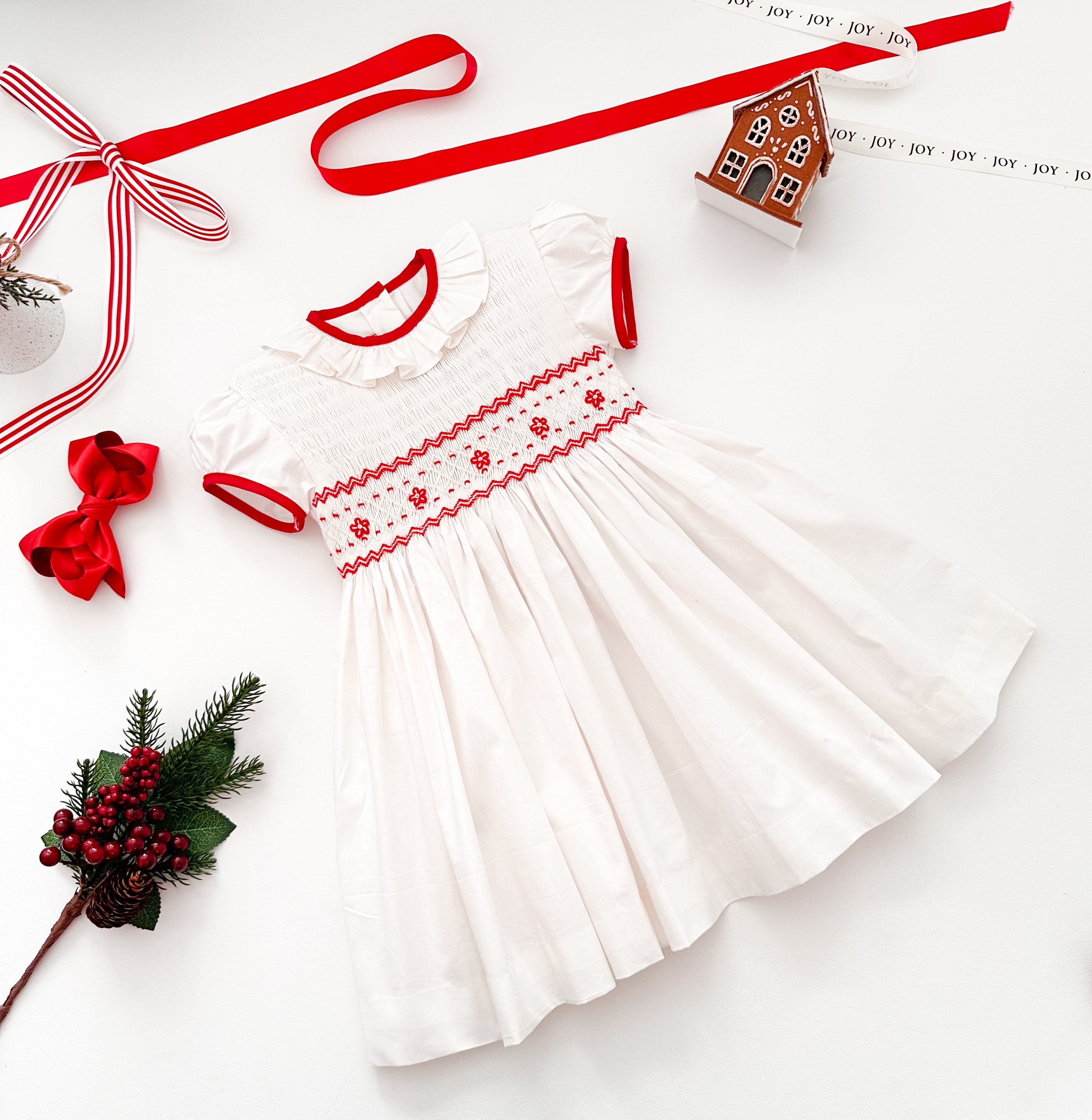 The hand smocked BENEDICTE dress - in white and red