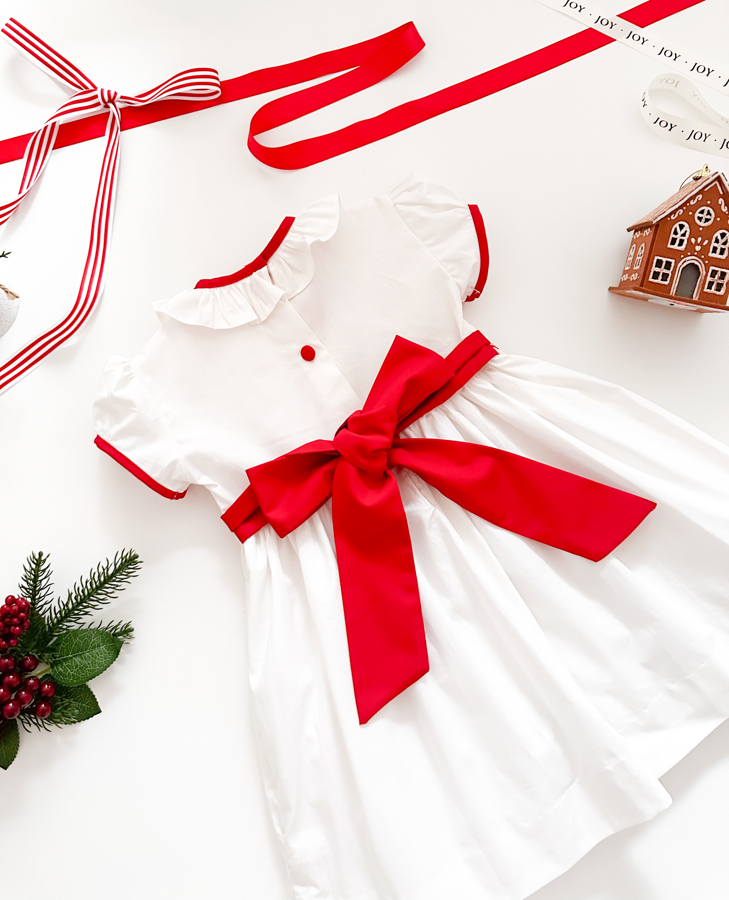 The hand smocked BENEDICTE dress - in white and red