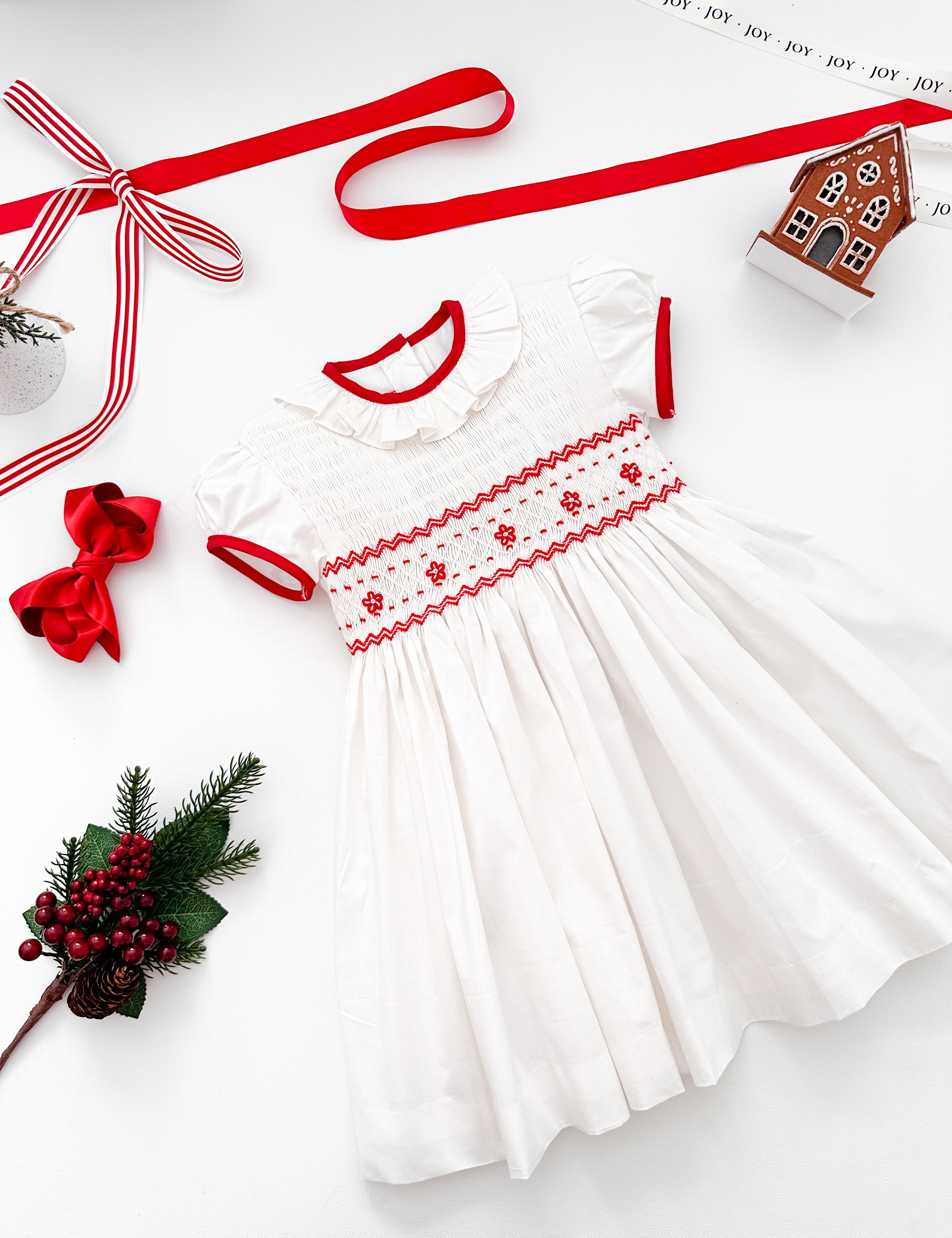 The hand smocked BENEDICTE dress - in white and red