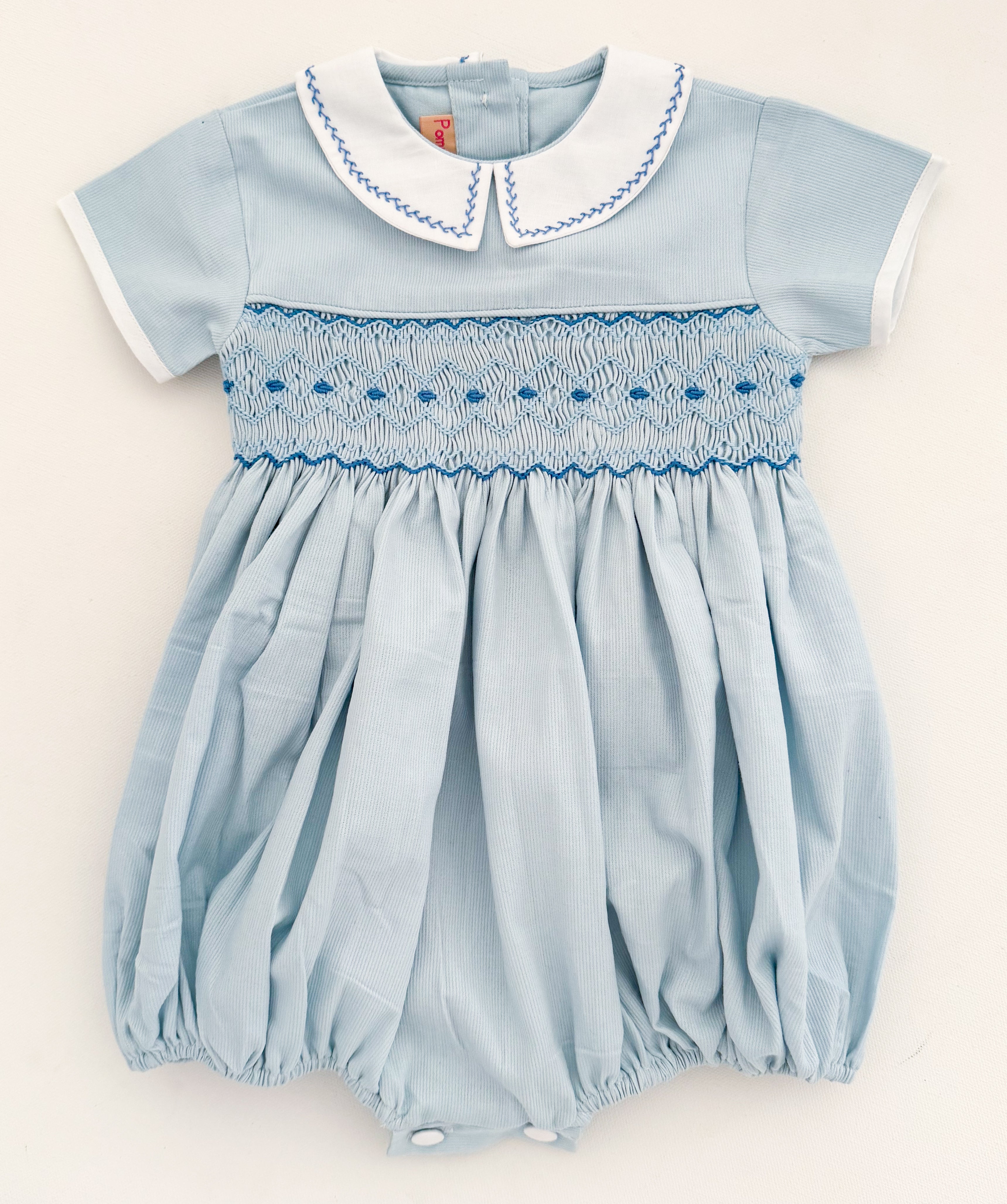 The hand smocked ANDRÉA romper - Blue