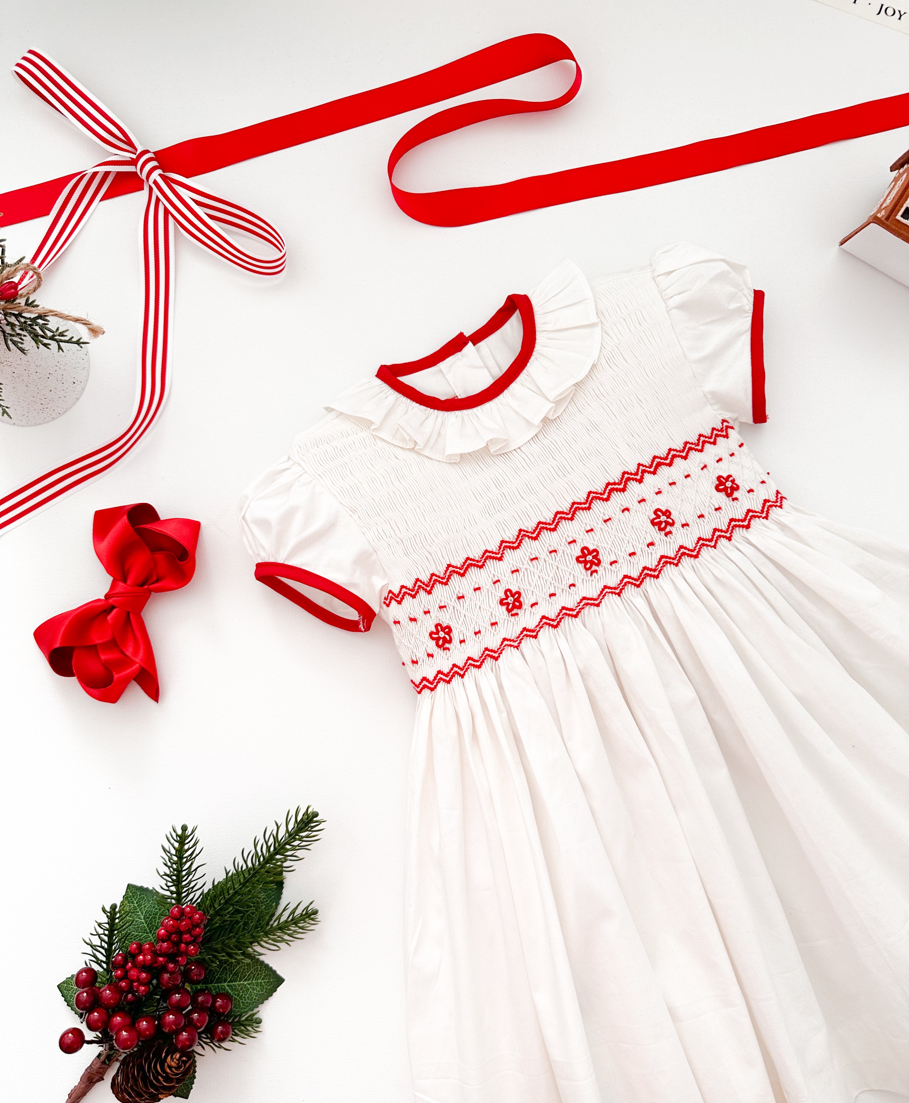The hand smocked BENEDICTE dress - in white and red