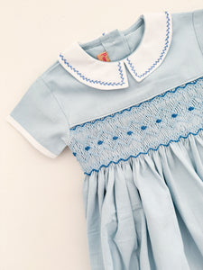 The hand smocked ANDRÉA romper - Blue