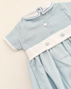 The hand smocked ANDRÉA romper - Blue