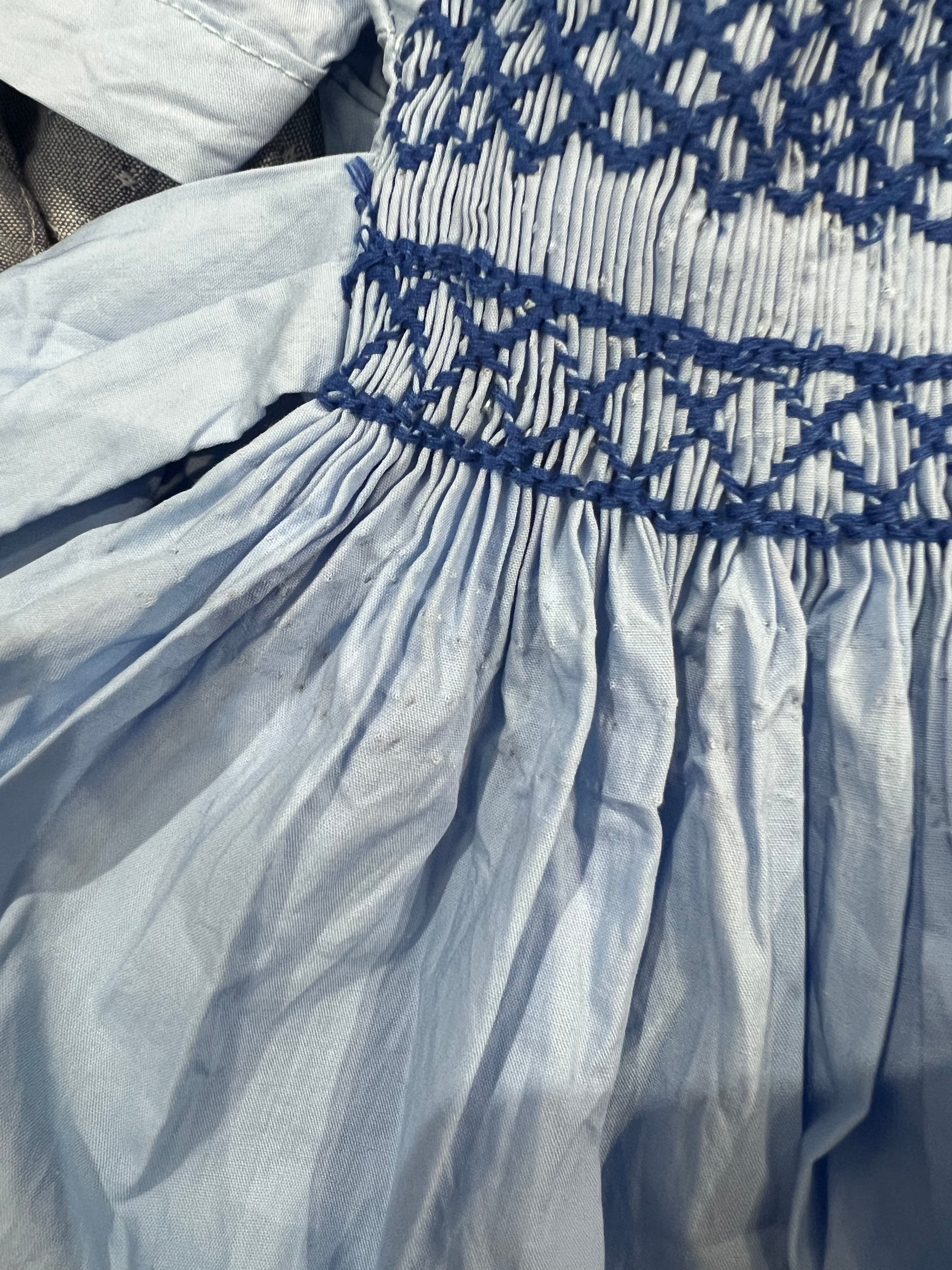 ** SECONDS SALE ** The hand smocked blue dress (visible needle marks)