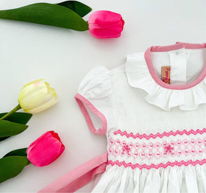 The hand smocked BENEDICTE dress - in white and pink