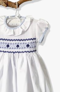 The hand smocked BENEDICTE dress - in white and blue