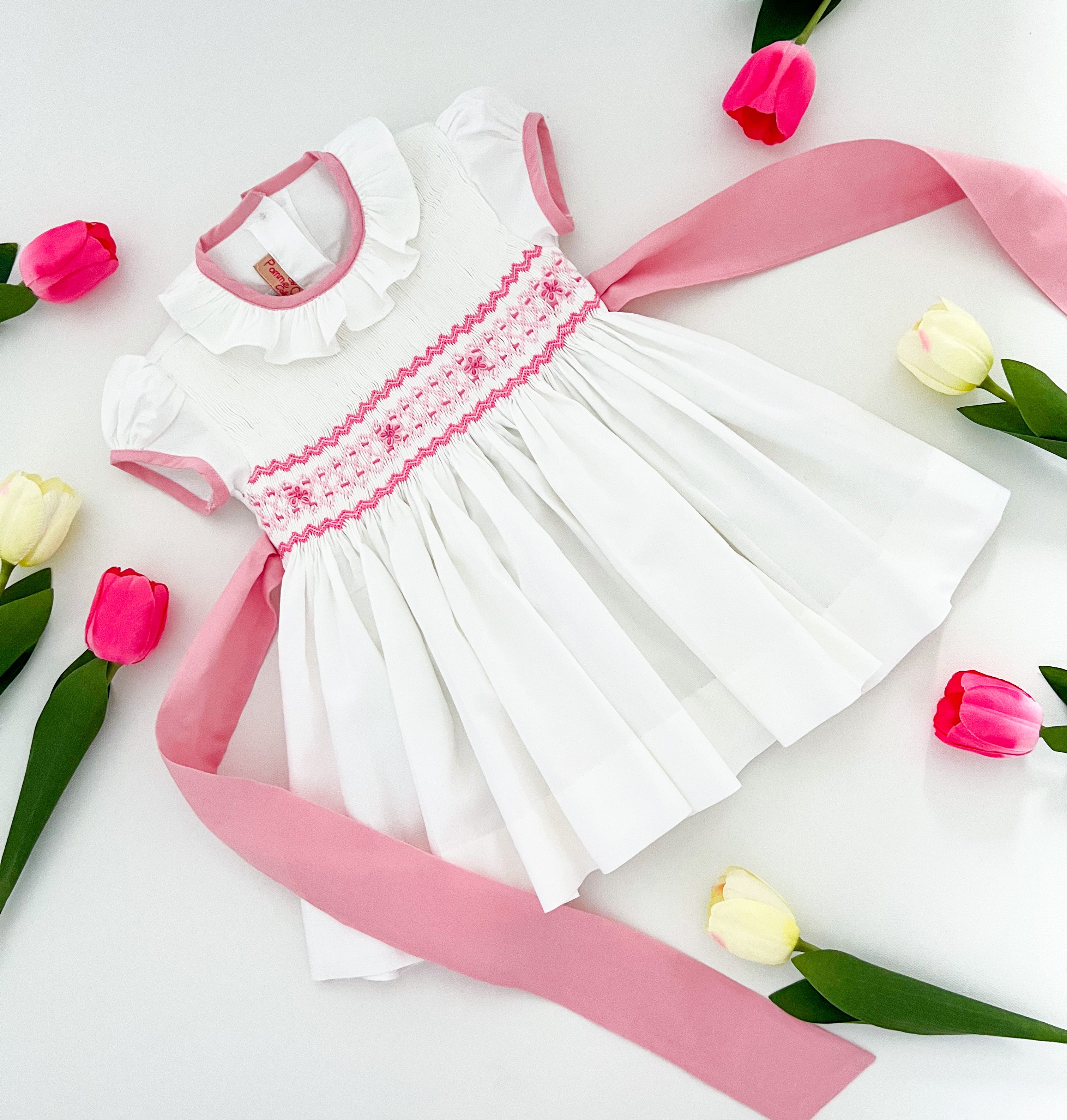 The hand smocked BENEDICTE dress - in white and pink
